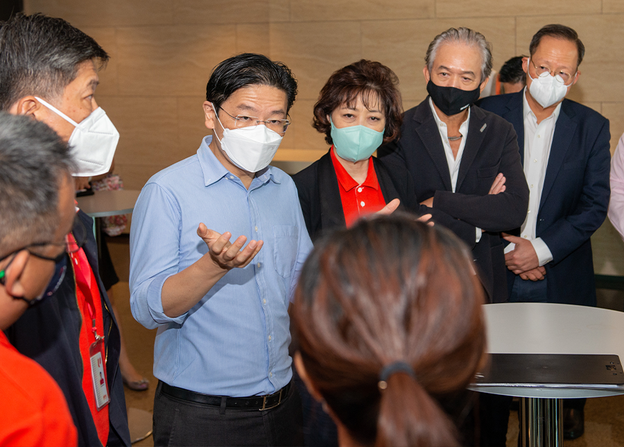 DPM Lawrence Wong speaking to some unionists and association representatives on the sidelines of the launch of the Forward Singapore exercise on 28 June 2022.