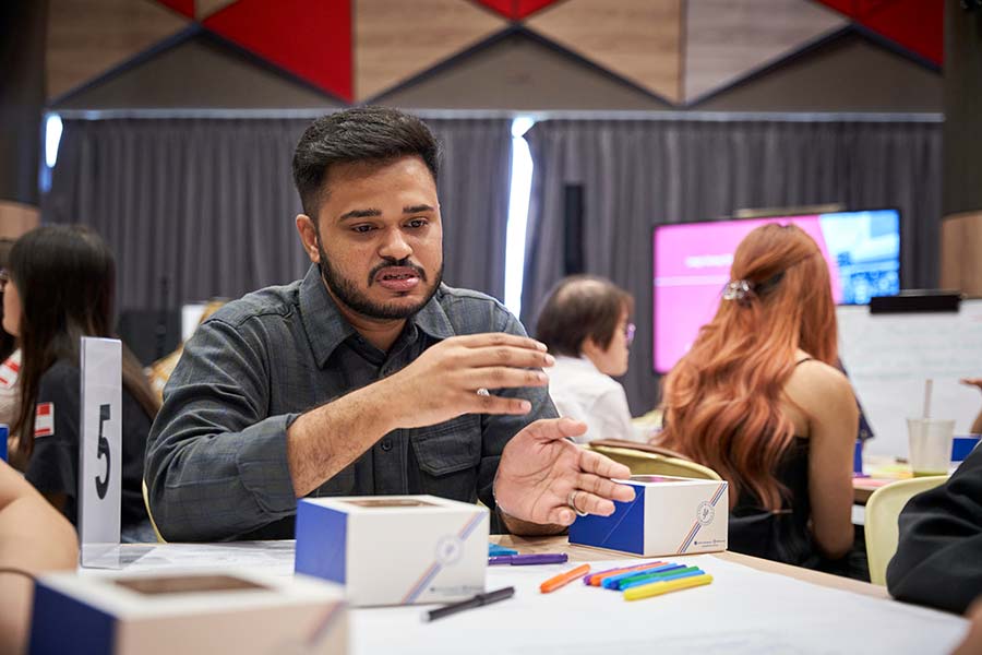 A participant sharing his thoughts in the breakout group discussion (Credit: MCI / Kai Xuan Ng) 