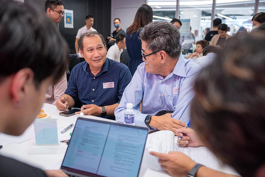 Participants discussing ways of how the Government and companies can collaborate to improve digital inclusion further.