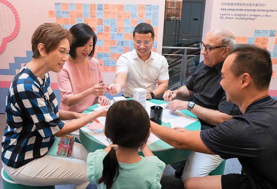 (From left) Minister Josephine Teo, Senior Minister of State Sim Ann, Minister Desmond Lee and Minister Iswaran interacting with members of the public at the roadshow on 6 November 2022. (Credit: MCI / Syafiq) 