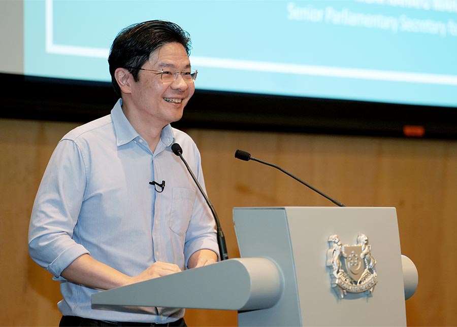 DPM Lawrence Wong addressing social service practitioners at the Forward Singapore Conversation.