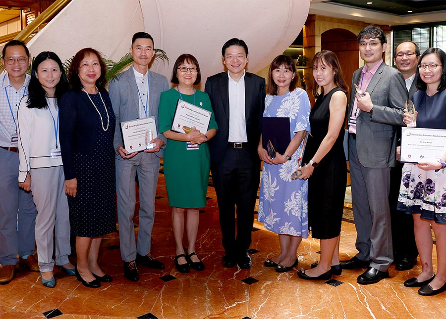 DPM Lawrence Wong with the winners and finalists of the Outstanding Economics Teacher Award 2022