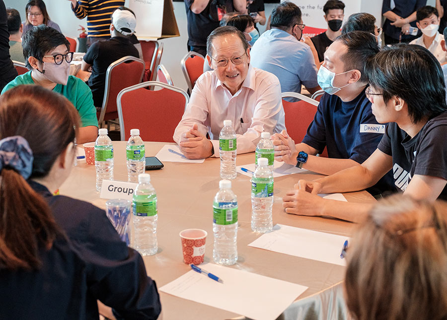 Minister Tan See Leng engaged in a small group discussion with PMEs.