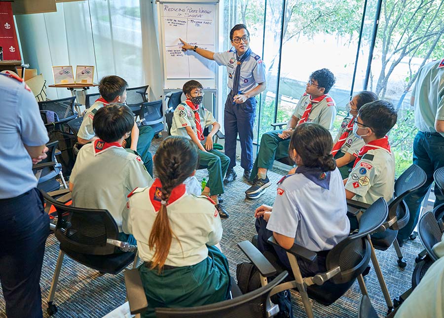 Participants from the Singapore Scouts Association discussing possible environmental sustainability initiatives.