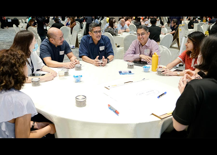 Participants discussing how society can better support lower-income families