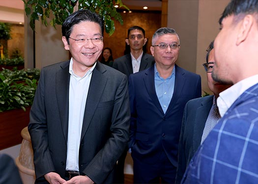 DPM Lawrence Wong speaking to participants at the Singapore Economics Policy Forum