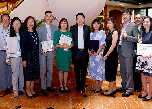 DPM Lawrence Wong with the winners and finalists of the Outstanding Economics Teacher Award 2022