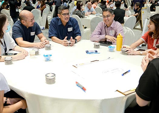 Participants discussing how society can better support lower-income families