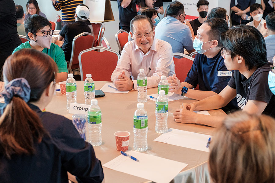 Minister Tan See Leng engaged in a small group discussion with PMEs.